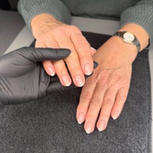 Classic French manicure with soft winter tones at La Suite Corbridge